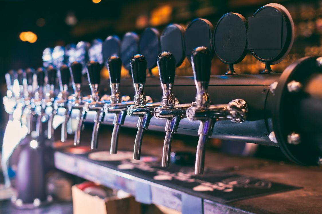 Beer tap row. Beer tap in the bar.